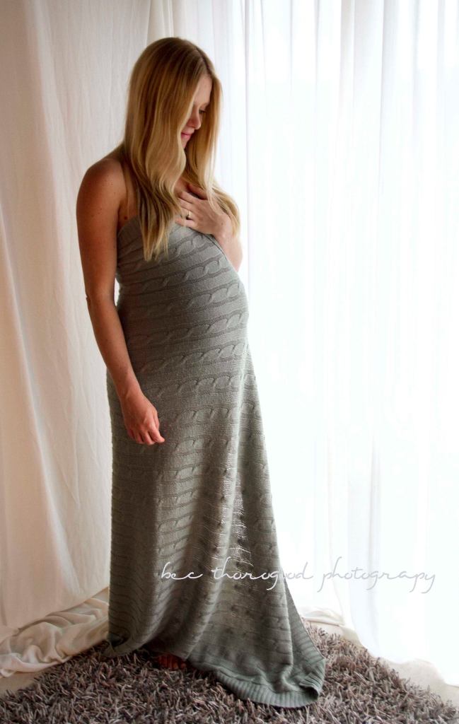 Maternity photograph. Backlit studio pregnancy shoot